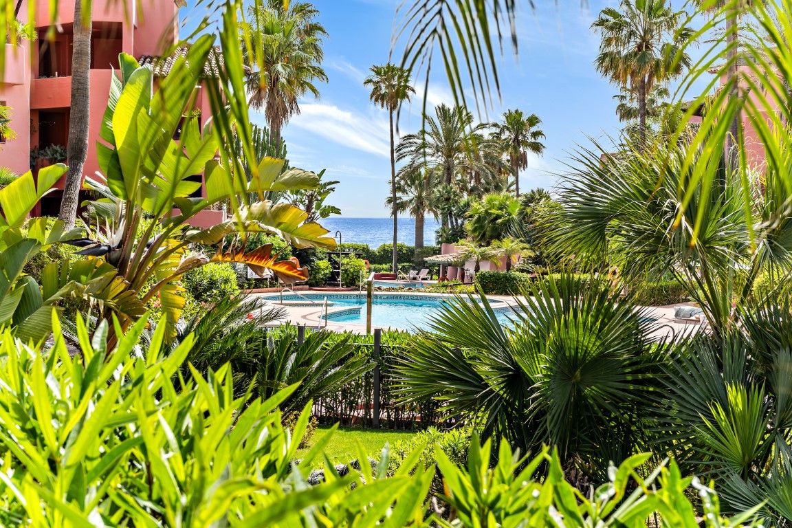 Impressive two bedroom, beach front ground floor apartment located in the luxury gated community of Menara Beach, Estepona.